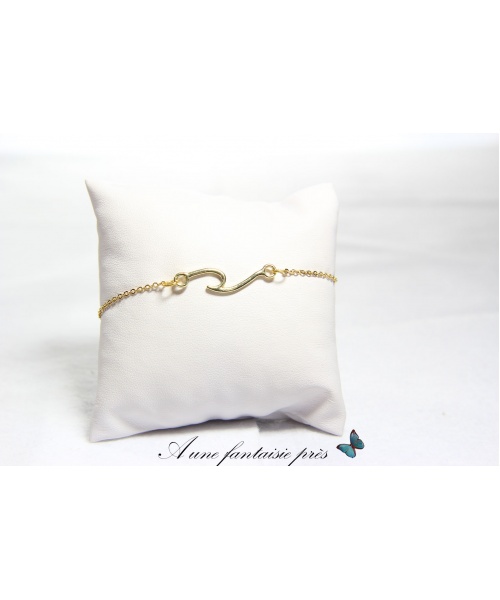 1206_-_bracelet_acier_inoxydable_dor_pendentif_vague__15_euros